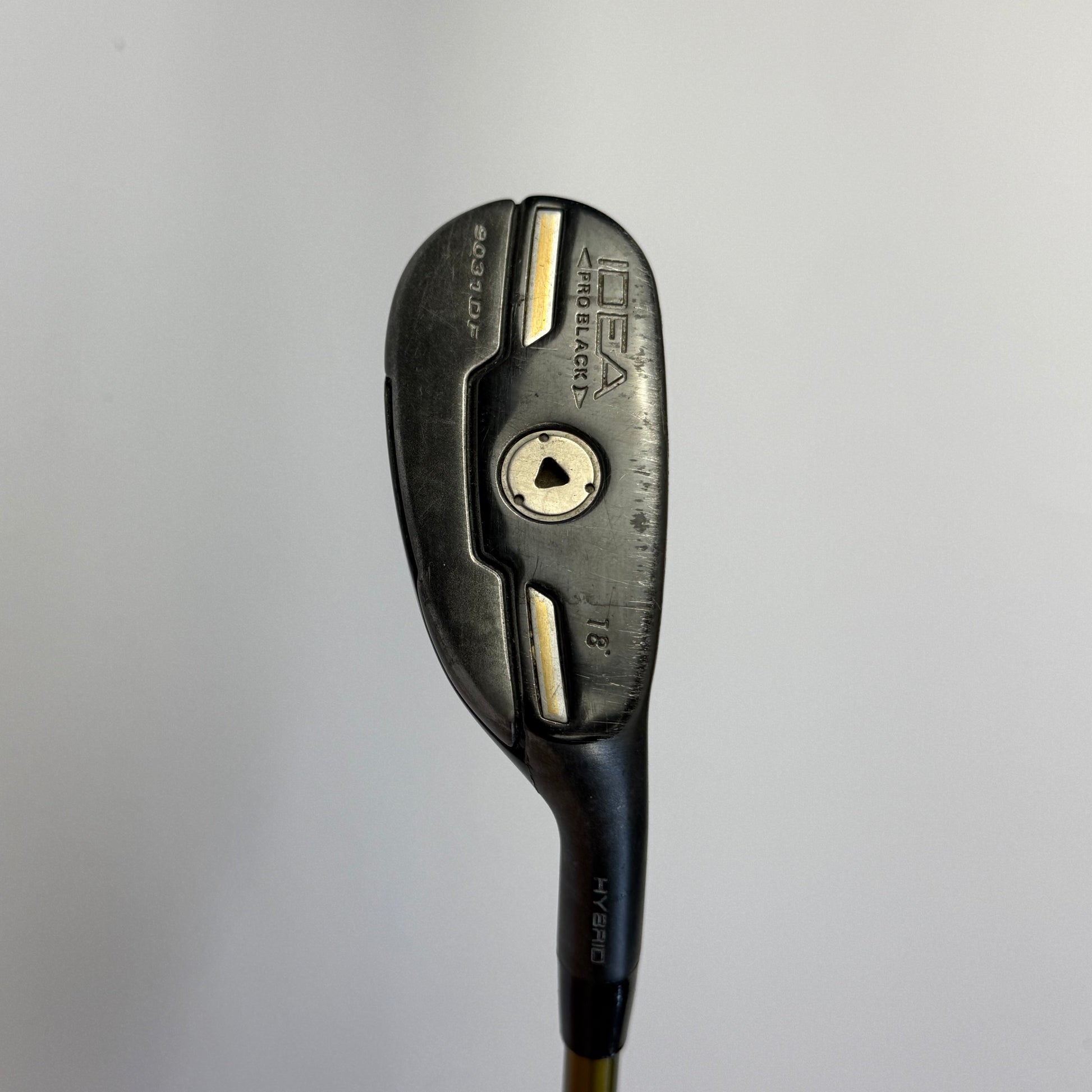 Adams Idea hybrid golf club on a gray background
