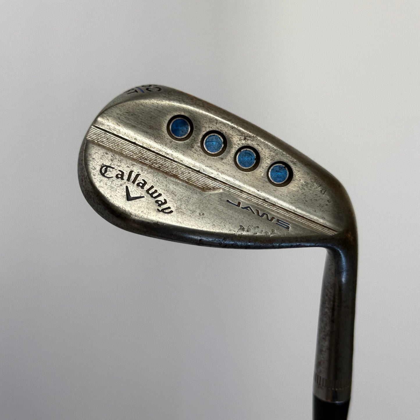 Callaway Jaws lob wedge golf club on a gray background