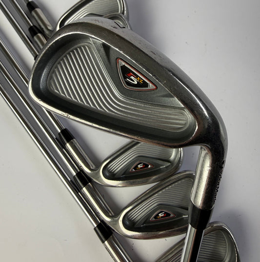 Taylormade R5 XL golf club iron set on a light gray background