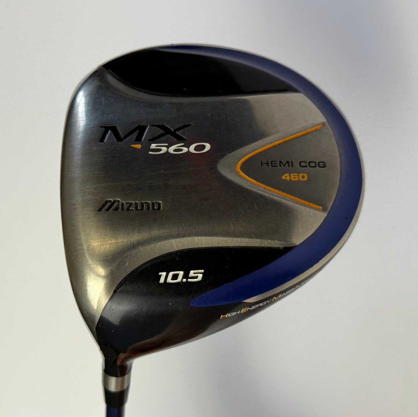 Golf club head with Mizuno branding on a light gray background