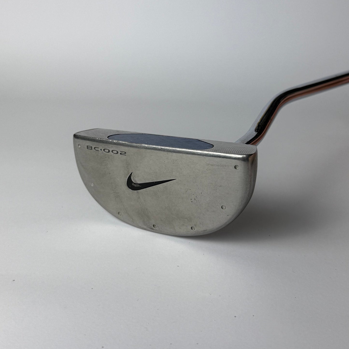 Golf putter with Nike logo on a white background