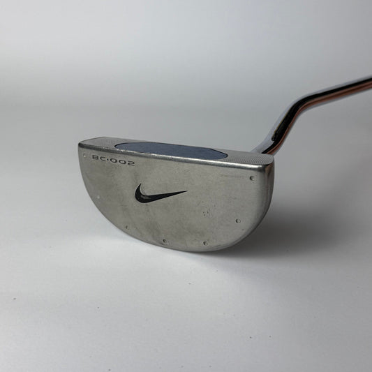 Golf putter with Nike logo on a white background
