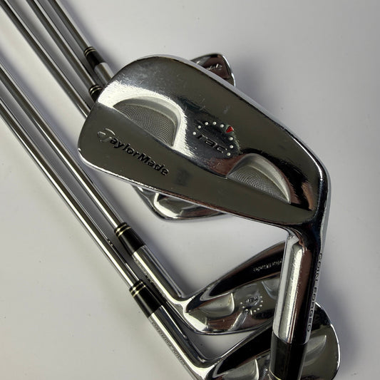 Taylormade RAC Coin Forged Blade Irons golf club set on a white background