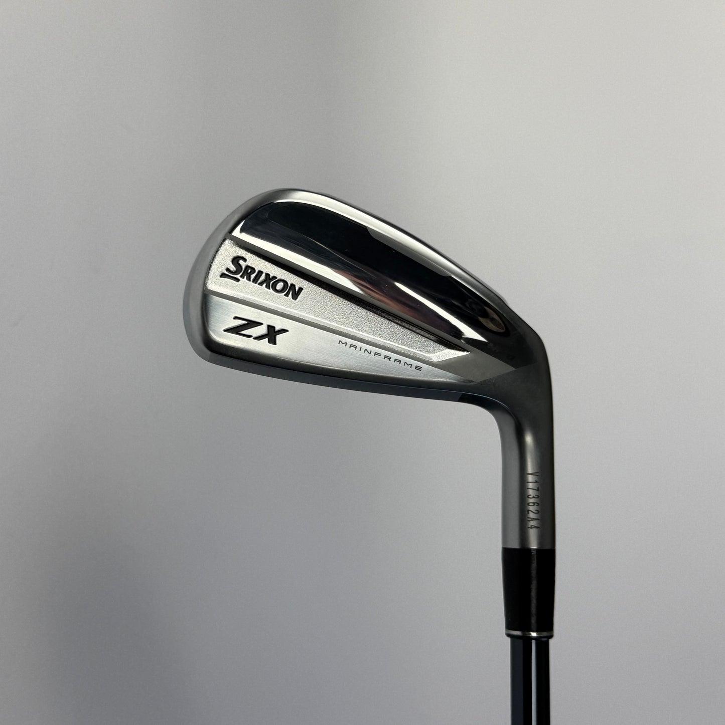 Golf club (driving iron) with 'Srixon XZ' branding on a gray background