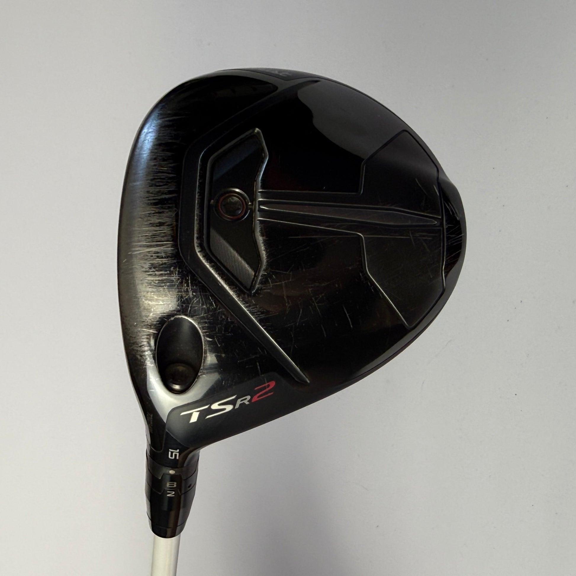 Fairway wood golf club head with Titleist TSR2 branding on a gray background
