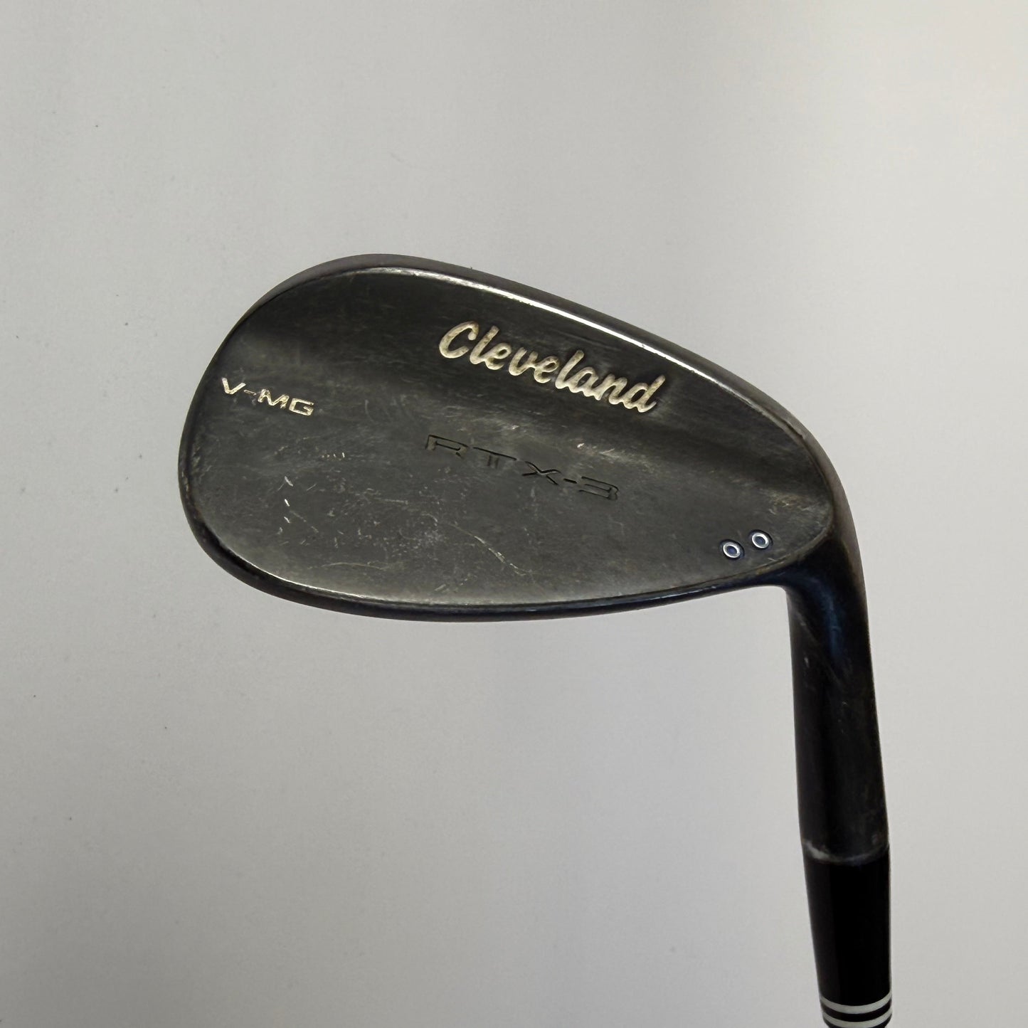 Wedge golf club with Cleveland RTX-3 logo on a gray background