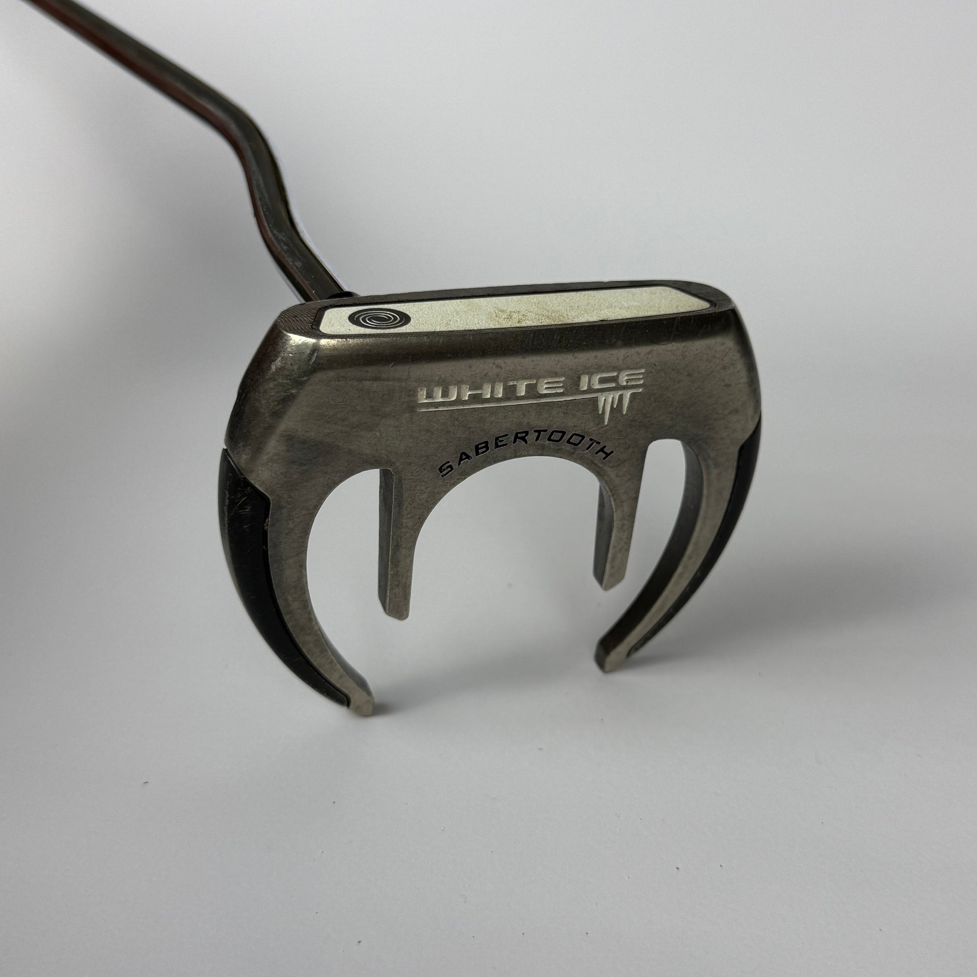 Odyssey White Ice Sabertooth putter on a white background
