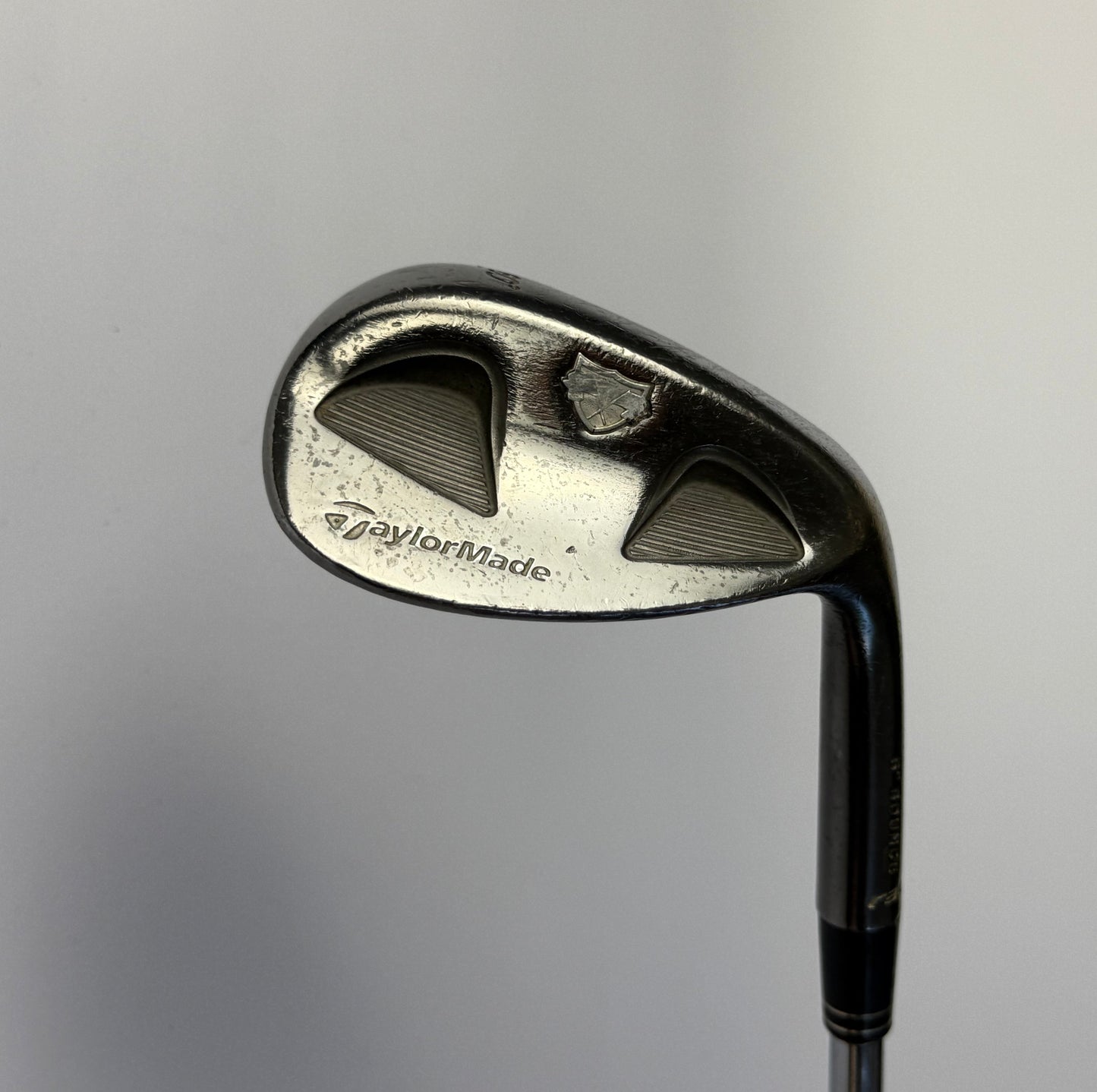 Taylormade RAC TP 60 Degree Lob Wedge golf club on a gray background