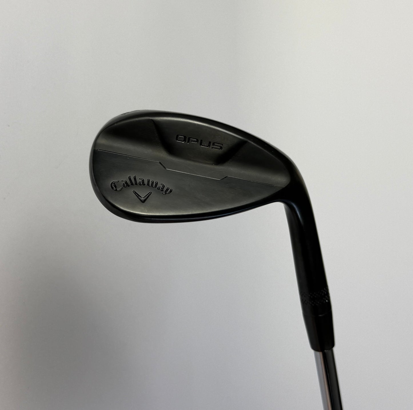 Callaway Opus Wedge golf club on a light gray background