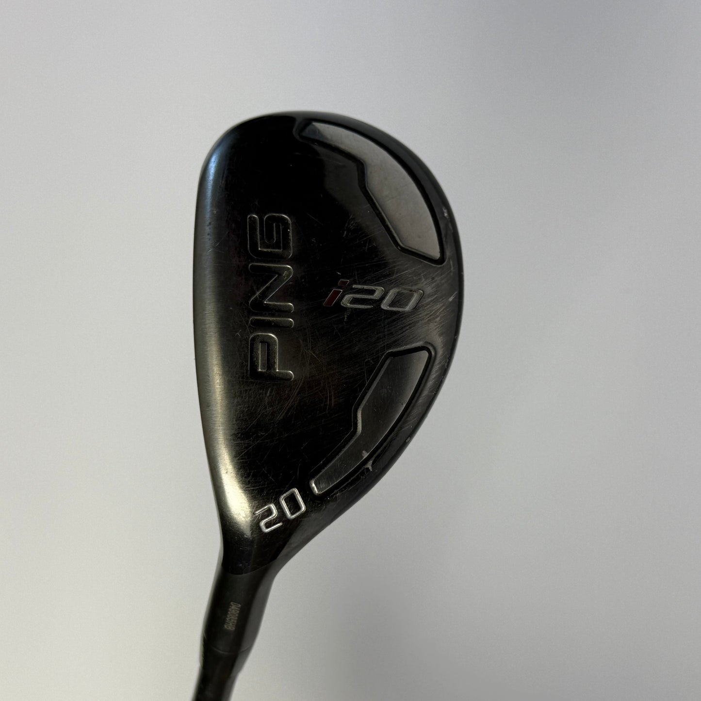 Hybrid golf club with 'PING' branding on a light gray background